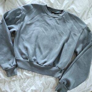 Cropped crew neck sweater